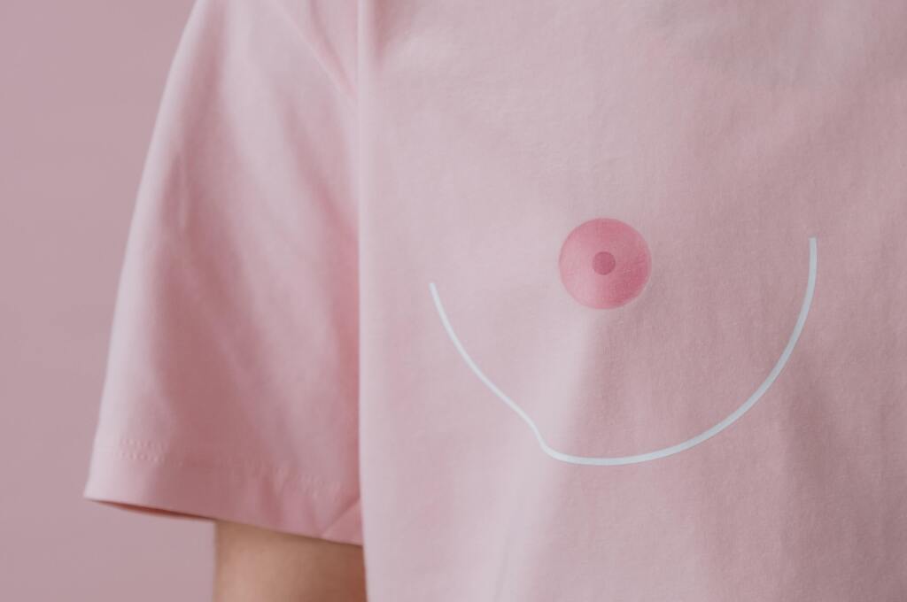 Cropped image of girl wearing a shirt with a boob and nipple design